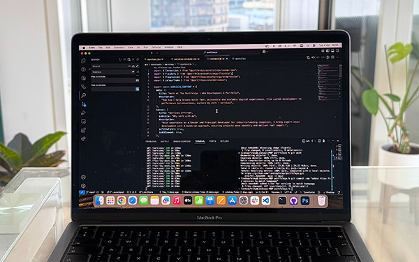 A laptop running Visual Studio Code